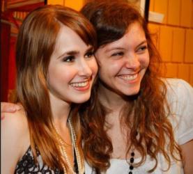 two women smiling at the camera