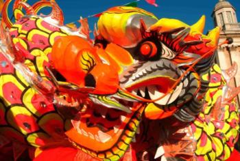 vibrant dragon dance costumes under blue sky