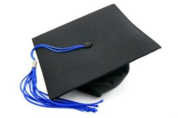 graduation cap on a diploma with red ribbon