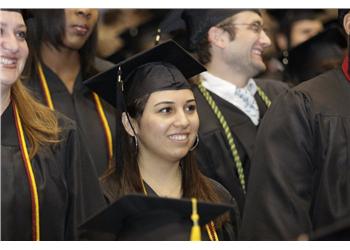 graduates smiling during commencement ceremony