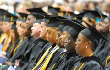 graduates in caps and gowns at ceremony