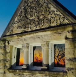 ornate building facade at dusk with reflections