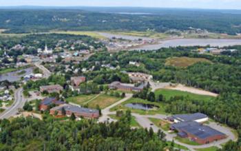 aerial view of campus buildings amid green landscapes