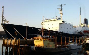 ship 'state of maine' docked with a tugboat