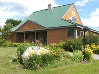 front view of a welcome center with landscaped garden