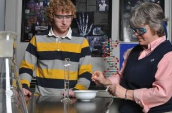 two people conducting a lab experiment