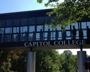 entrance sign reading 'capitol college' with silhouette of people