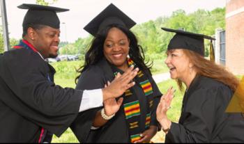 three graduates celebrating