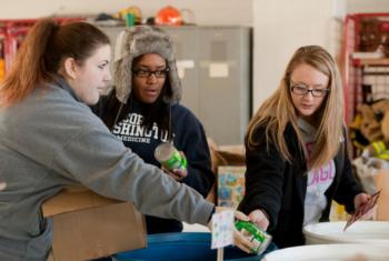 students volunteering at a food drive