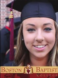 graduate smiling with 'boston baptist college' on mortarboard