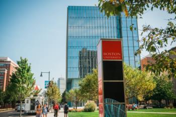 campus walkway with 'boston university' sign