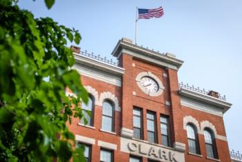 brick building with clock tower and 'clark' inscription