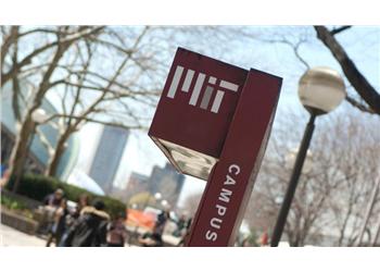 mit campus sign with blurred background