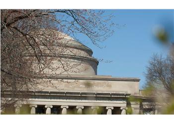 mit's iconic dome structure partially obscured by foliage