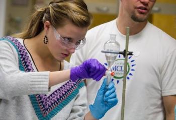 two people conducting a chemistry experiment