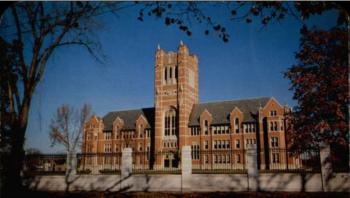 historic brick building with tall tower