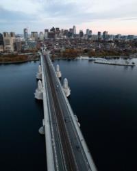 aerial view of a bridge over a river at dusk