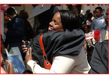 two people embracing in a crowd