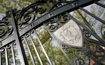 ornate metal gate with crest design