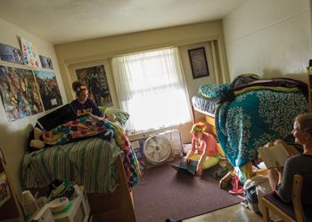 students studying in a dorm room