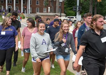 students walking across albion college campus