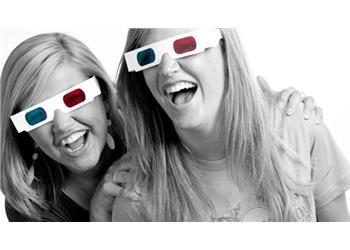 two women laughing wearing 3d glasses