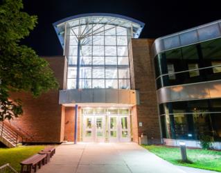 night view of illuminated campus building entrance