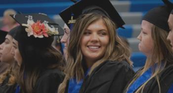 graduates in caps and gowns at a ceremony