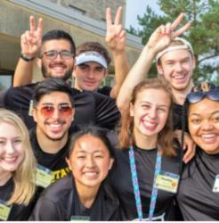 smiling students posing with peace signs