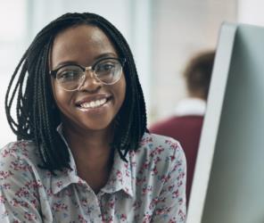 smiling student using computer