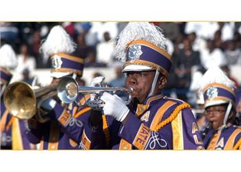 marching band in purple uniforms playing instruments