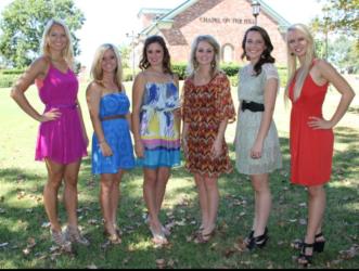 group of women posing in front of 'School of Nursing' building