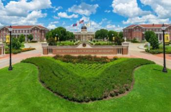 lush lawn with 'university of southern mississippi' sign and buildings