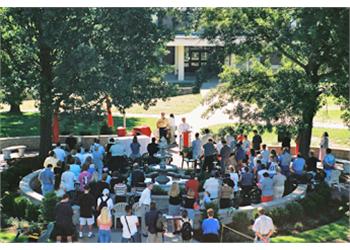 outdoor gathering around a campus fountain