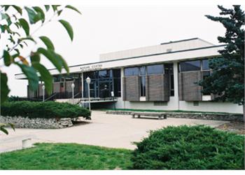 exterior view of a campus building with trees