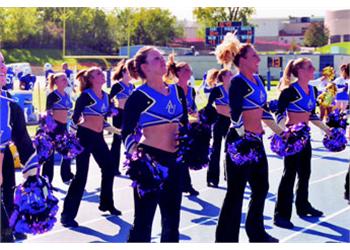 cheerleaders in formation at a sports event