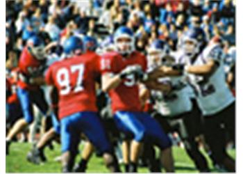 blurry image of a football game in action