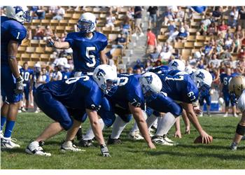 football players lined up on field