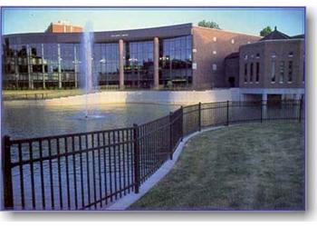 modern buildings with a fountain in an evening setting