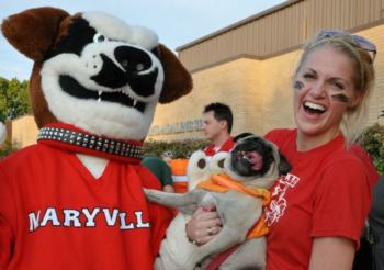 woman and dog with person in mascot costume