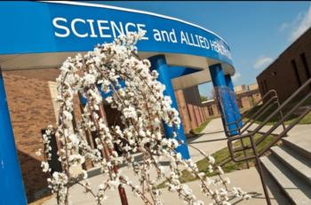 blossoming tree in front of 'SCIENCE and ALLIED HEALTH' building