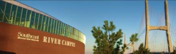 modern building with 'southeast river campus' sign and bridge