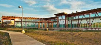 modern building with wooden facade at sunset