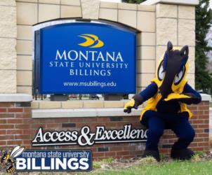 mascot posing near 'montana state university billings' sign