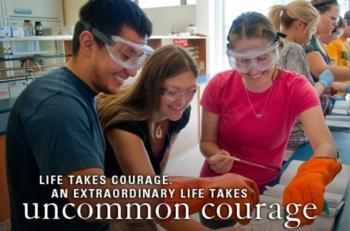 students in lab with text 'life takes courage, an extraordinary life takes uncommon courage'