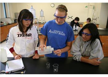 students conducting a science experiment in a lab