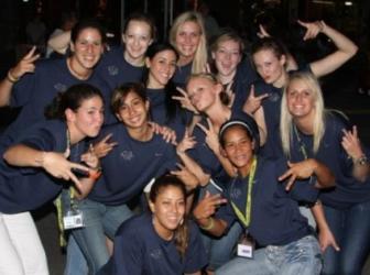 group of people posing with hand gestures