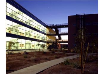 modern building with glass facade at dusk