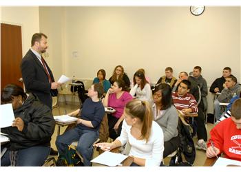 instructor teaching in classroom with attentive students