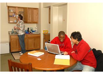 students studying with laptop in university housing